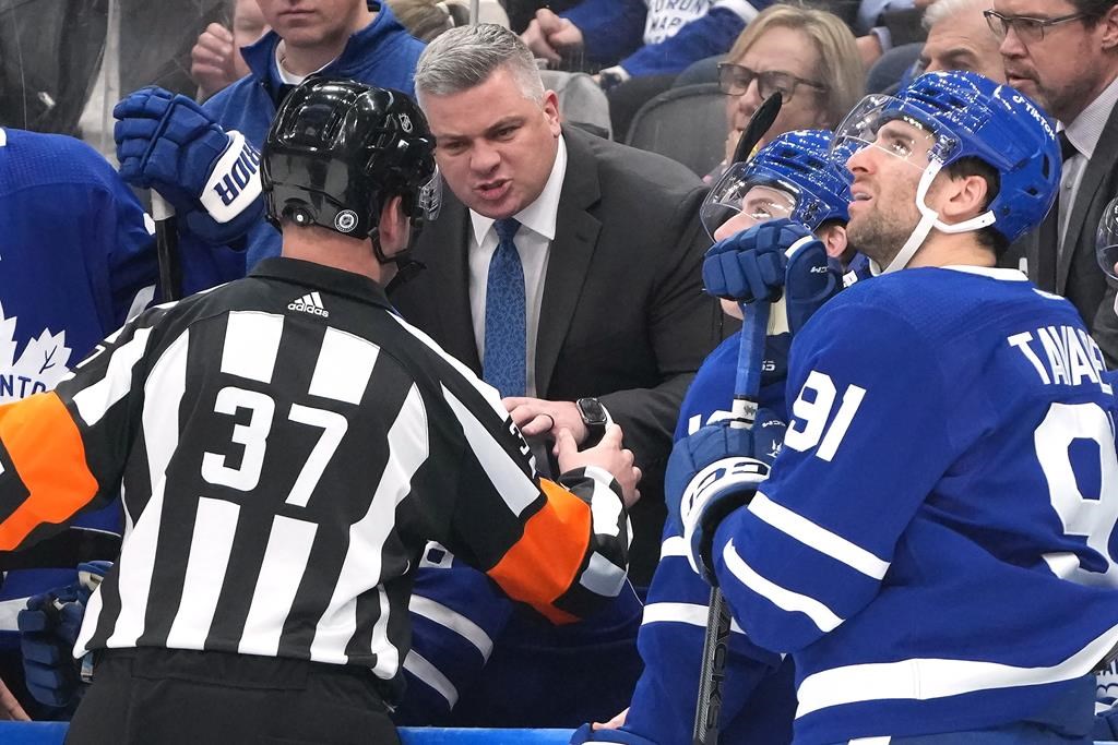 Toronto Maple Leafs coach Sheldon Keefe walks behind his bench during the  first period of the t …