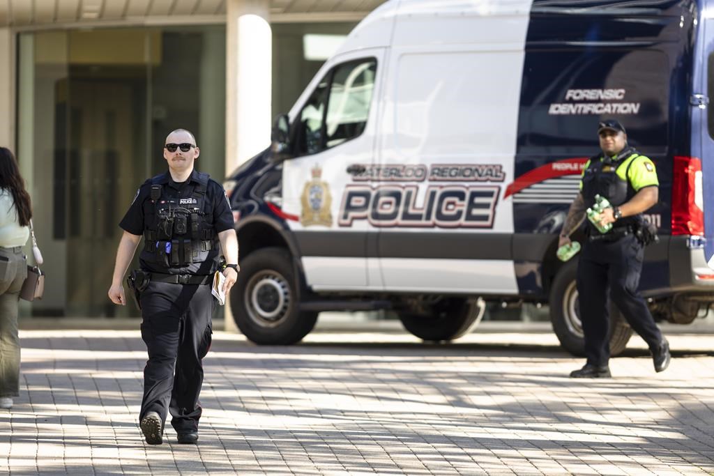 Members of the Waterloo Regional Police investigate a stabbing at the University of Waterloo, in Waterloo, Ont., Wednesday, June 28, 2023. Waterloo Regional Police said three victims were stabbed inside the university's Hagey Hall. One person was taken into custody.
