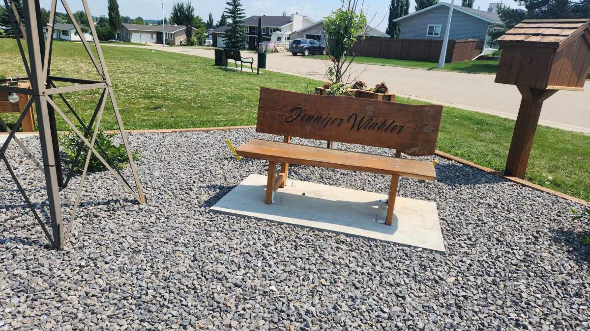 Memorial bench at Jenny's Corner in Millet, Alta.