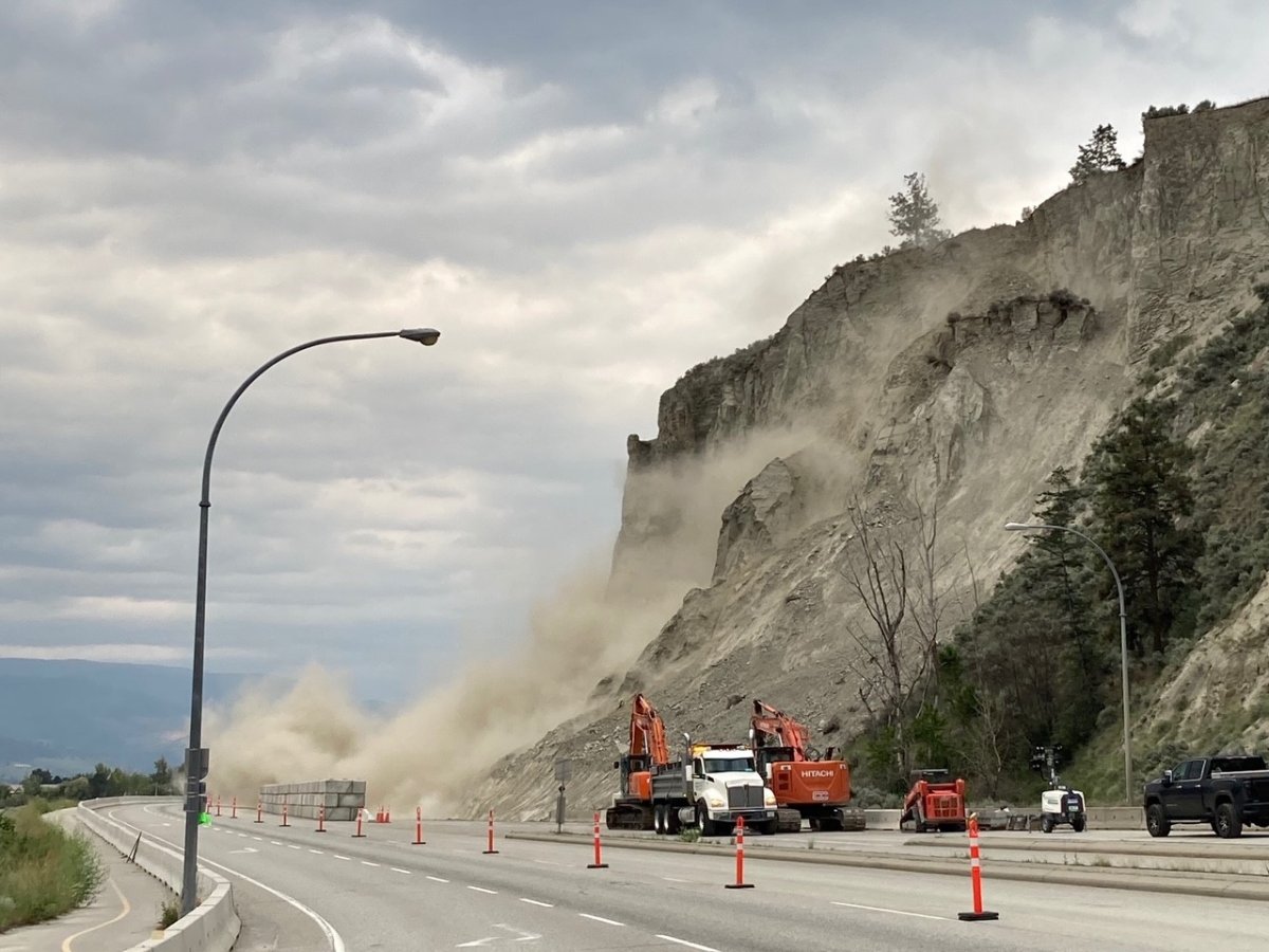 FILE. Dust lifts into the sky as crews work to remove a landslide along Highway 97 just south of Summerland.
