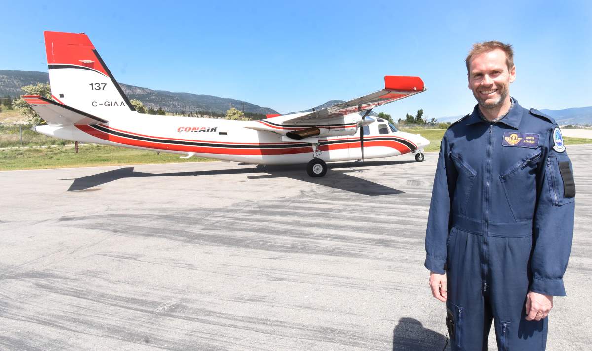 Air attack officer Greg Adams of the BC Wildfire Service and the bird dog plane he flies in to orchestrate the aerial firefighting efforts.