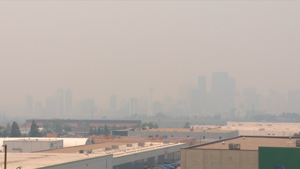 The view of downtown Calgary from across Deerfoot Trail is obscured by smoke at noon on June 15, 2023.