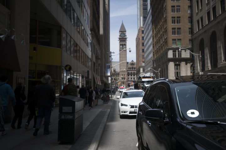 An Uber ride share vehicle sitting in traffic on Bay St. in Torontos Financial District, is photographed on June 12 2019.