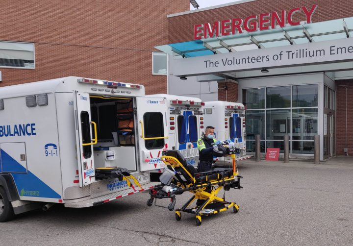 MISSISSAUGA, Oct. 8, 2021  A paramedic organizes equipment outside the emergency building of a hospital in Mississauga, Ontario, Canada, on Oct. 7, 2021. 