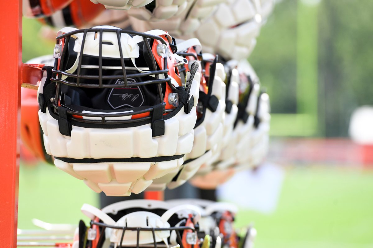 Cleveland Browns helmets, with Guardian Caps, hang from a rack during the NFL football team's training camp, Thursday, July 28, 2022, in Berea, Ohio. The mushroom-like contraptions NFL players are wearing on their helmets during training camp may look strange, but theyâ€™re a part of an ongoing safety experiment the league hopes will lead to a reduction in head injuries. Theyâ€™re called Guardian Caps, and theyâ€™re now mandatory for all 32 NFL teams through the second preseason game -- the time when the league says head injuries are most prevalent.
