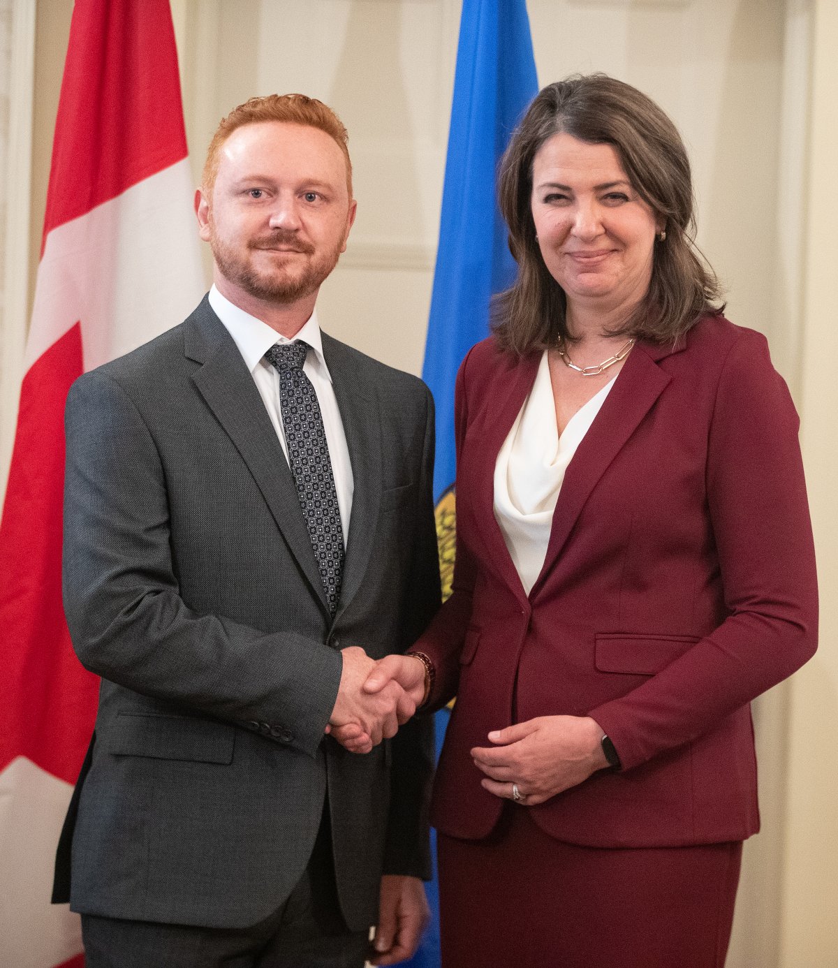Alberta Premier Danielle Smith and Justice Minister Mickey Amery stand together during the swearing in of her cabinet in Edmonton on Friday, June 9, 2023. Alberta is proposing legislation to make it easier to change dollar limits and rules surrounding gifts for elected officials.