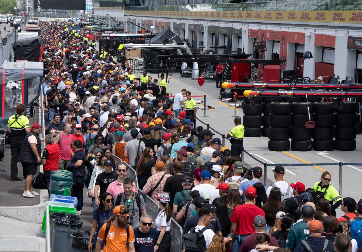 Race fans walk through pit lane during the open house at the Canadian Grand Prix Thursday, June 15, 2023 in Montreal. Formula One is back in Canada for a second consecutive year as the Canadian Grand Prix gets underway this week in Montreal.THE CANADIAN PRESS/Ryan Remiorz