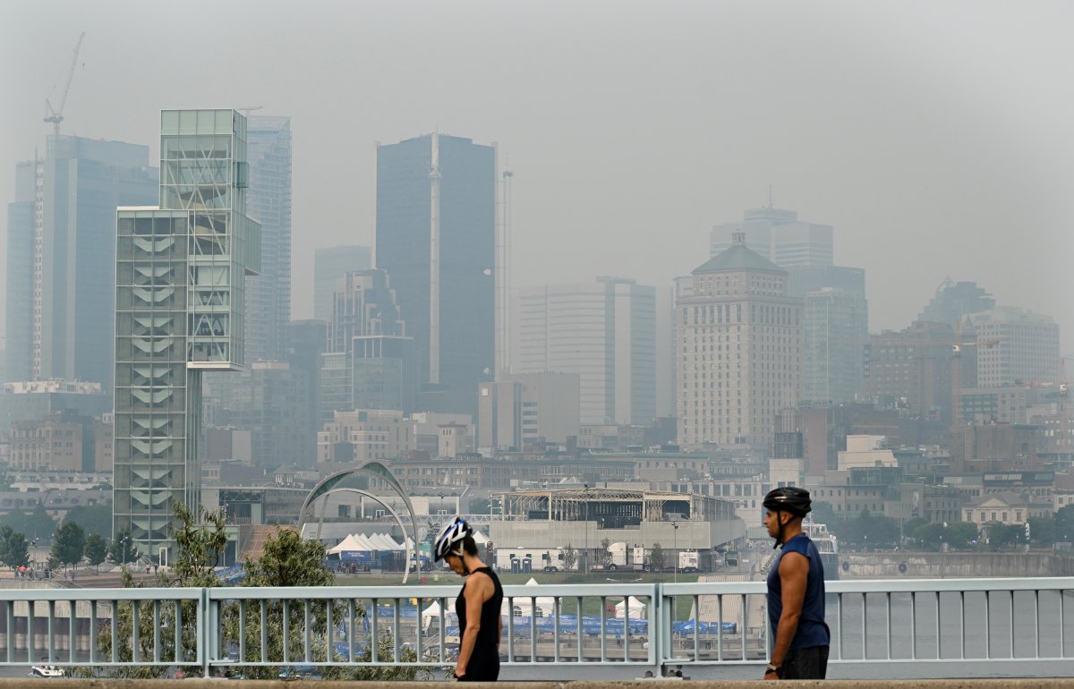 The skyline of Montreal is obscured by a haze of smog, Sunday, June 25, 2023, as a smog warning is in effect for Montreal and multiple regions of the province due to forest fires.