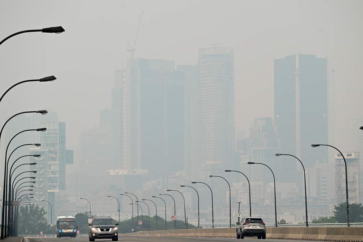 The skyline of Montreal was obscured by a haze of smog on Sunday, June 25, 2023, as a smog warning was in effect for Montreal and multiple regions of the province due to forest fires.