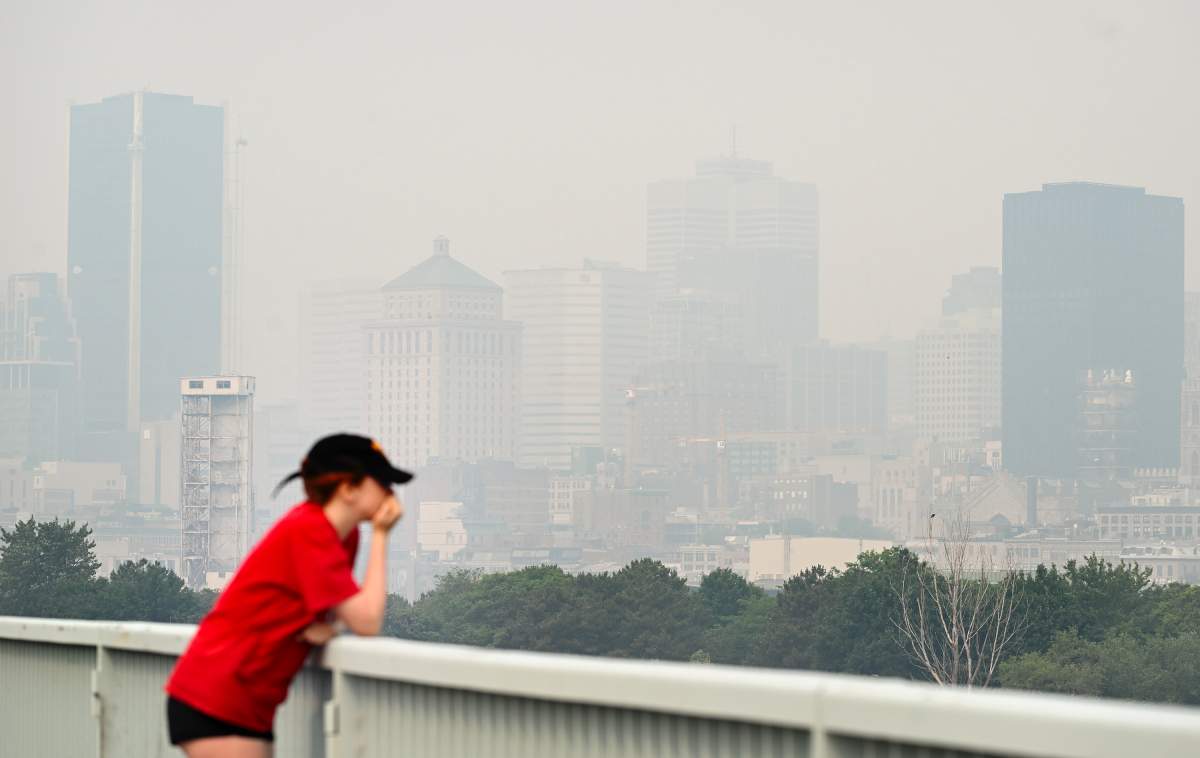 The skyline of Montreal is obscured by a haze of smog, Sunday, June 25, 2023, as a smog warning is in effect for Montreal and multiple regions of the province due to forest fires.