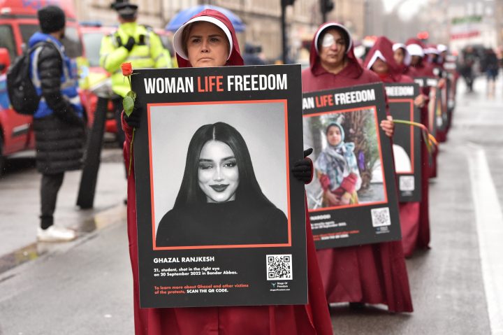 March 8, 2023, London, England, United Kingdom: Protesters dressed up as handmaids marched through Whitehall in solidarity with the growing freedom uprising in Iran, over the death of Mahsa Amini following her arrest by the Iranian morality police. Mahsa Amini was killed in custody on 16 September, after her arrest for allegedly breaching Iran's laws for women on wearing hijab, headscarves and modest clothing. 