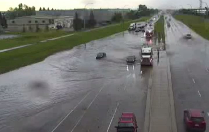 A City of Calgary traffic camera showed a car that appeared to be partially submerged at Glenmore Trail and 52nd Street S.E. on June 29, 2023.