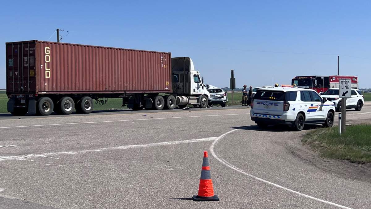 RCMP members on scene of a June 6 crash on Highway 9, northwest of Strathmore, that sent two people to hospital.
