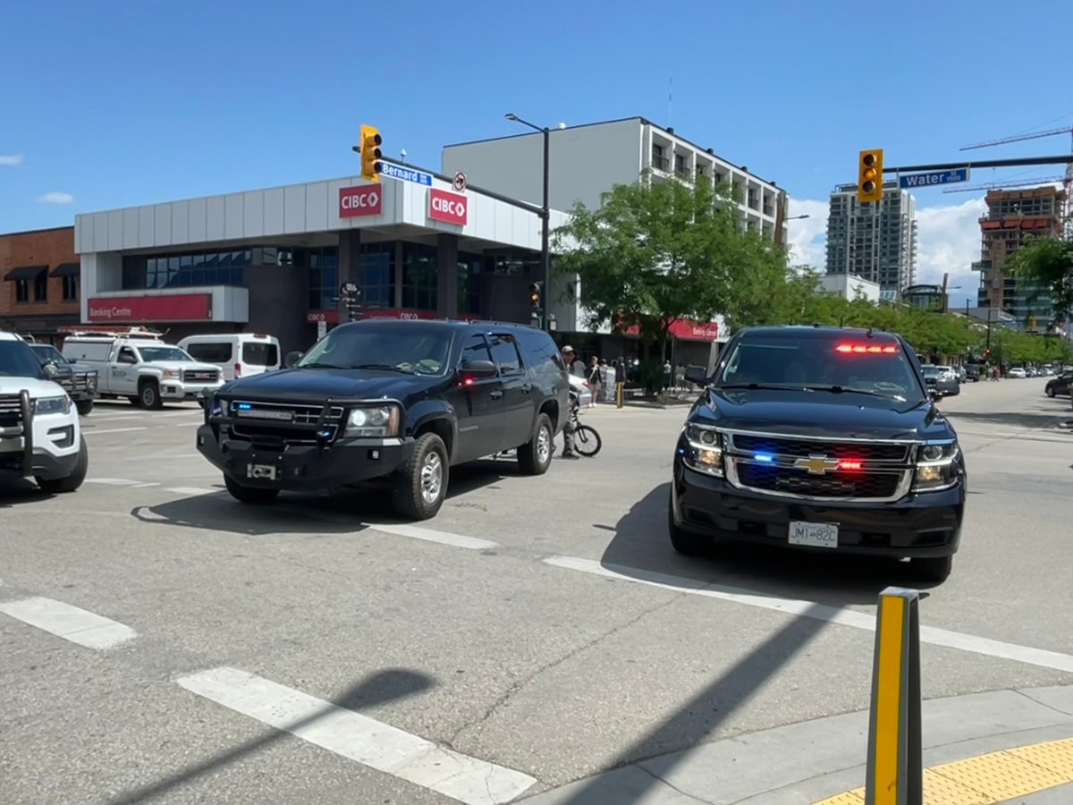 Police vehicles parked along Bernard Avenue on Wednesday following a report of a man allegedly carrying a gun in the downtown core.
