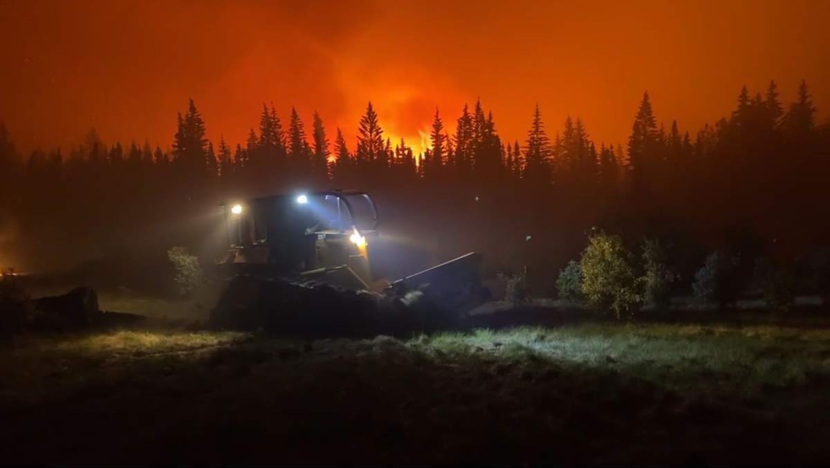 Heavy equipment working to build a new containment line ahead of the EWF031 wildfire burning near Edson, Alta. on Friday June 9, 2023.