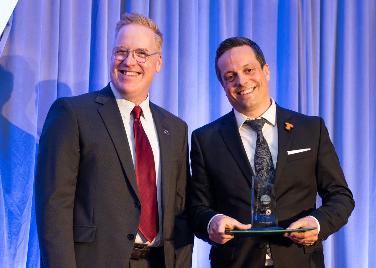 Court Desautels (on right with Eric Johnstone) receives the first-ever Frank Hasenfratz Award of Excellence at the Guelph Awards of Excellence.