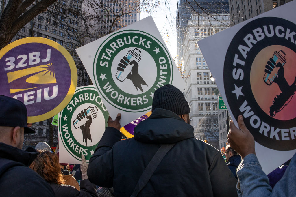 File - Members of a recently formed union of Starbucks workers hold a rally to celebrate the first anniversary of their founding, December 9, 2022 in New York City.
