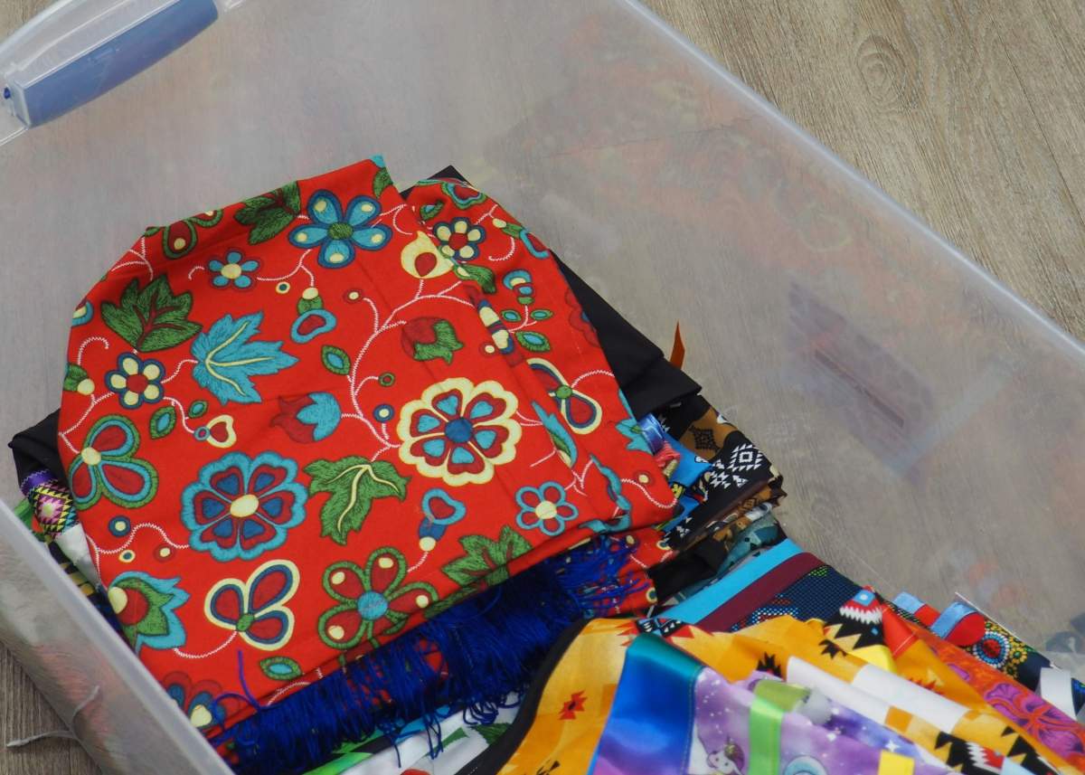 A pile of material lays folded in a bin