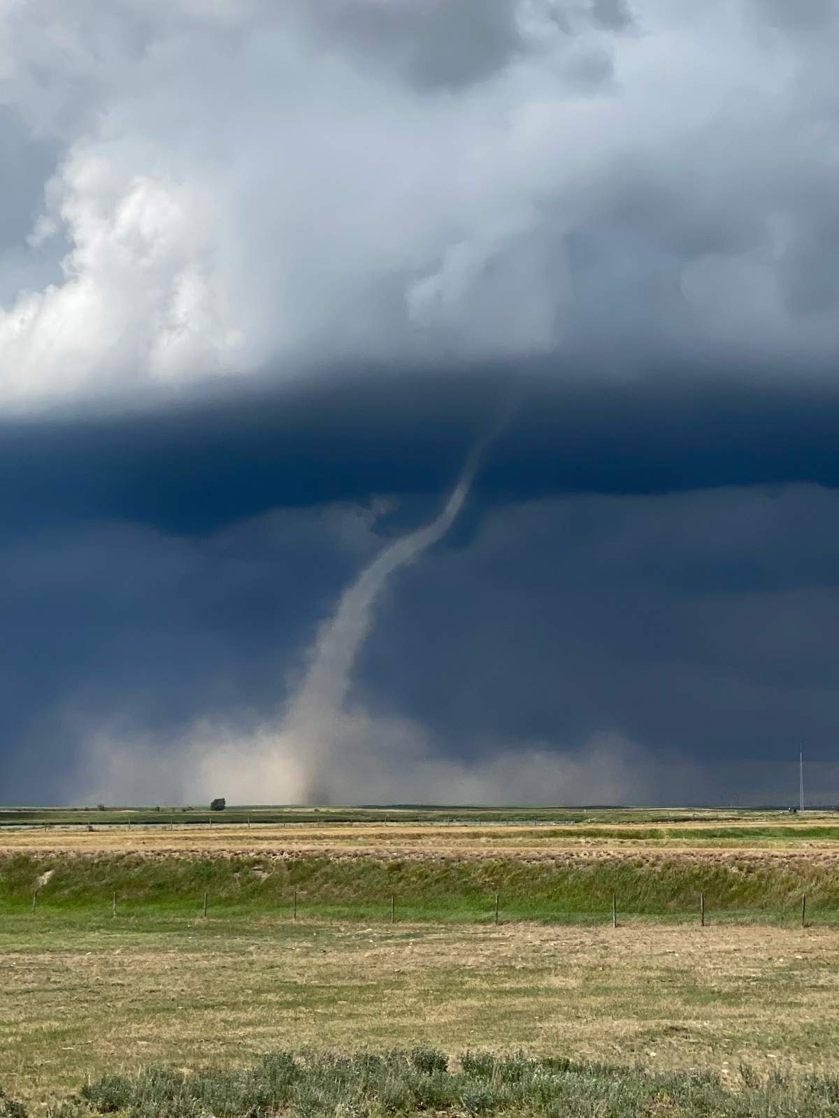 A picture of a funnel cloud near Iron Springs, Alta. on the afternoon of Jun. 14, 2023.