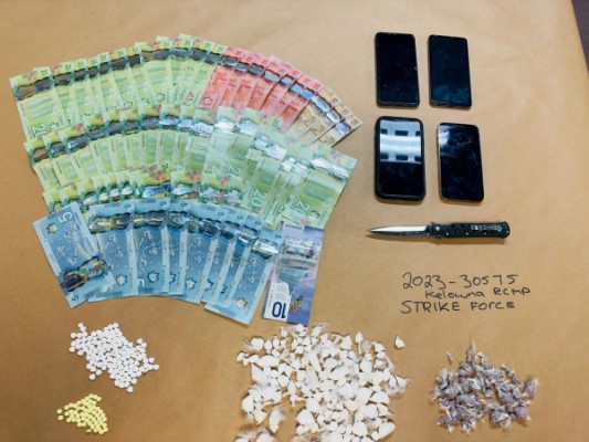 A photo of the items Kelowna RCMP seized after a vehicle was stopped by police on June 2, 2023.
