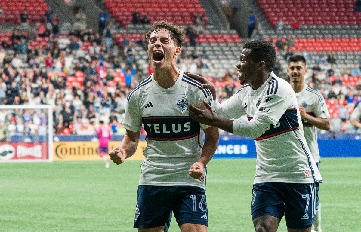 Sebastian Berhalter of the Vancouver Whitecaps, left, celebrates a goal with teammate Deiber Caicedo during MLS action against the Houston Dynamo at B.C. Place in Vancouver on Wednesday, May 31, 2023. The attendance for that game was 13,232. The stadium has a seating capacity of 54,500.