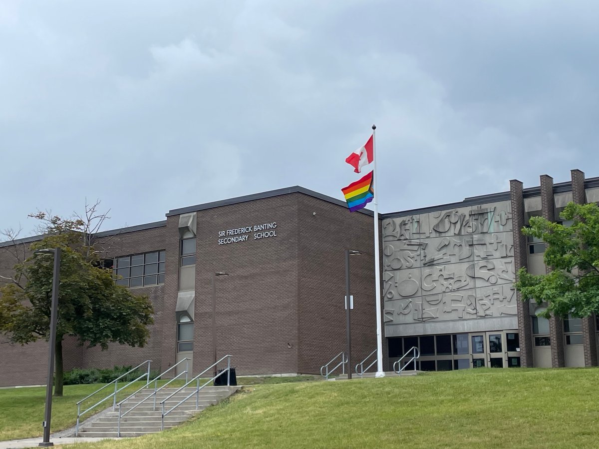 A Pride flag and Canadian flag flying at Sir Fredrick Banting Secondary School on June 14, 2023.
