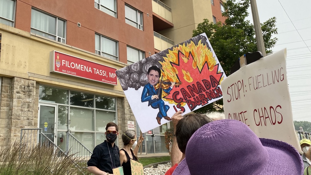 Scenes from one of several ‘Canada is Burning’ rally’s at MP offices across Canada. About a two-dozen are shown in front of Hamilton West—Ancaster—Dundas’ Filomena Tassi’s office in Hamilton’s west side.