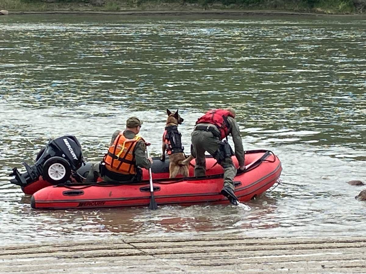 A photo of EFRS searching for a missing teen on the North Saskatchewan River.