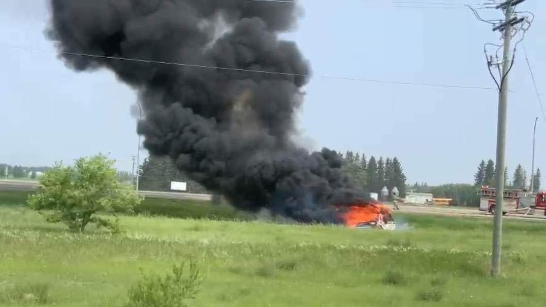 A vehicle in flames near the scene of a serious crash on the Trans-Canada Highway.