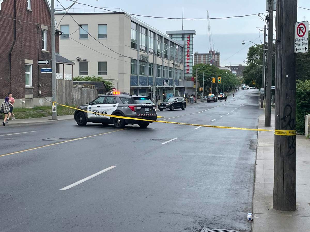 Police at the scene on Dufferin Street on June 23, 2023.