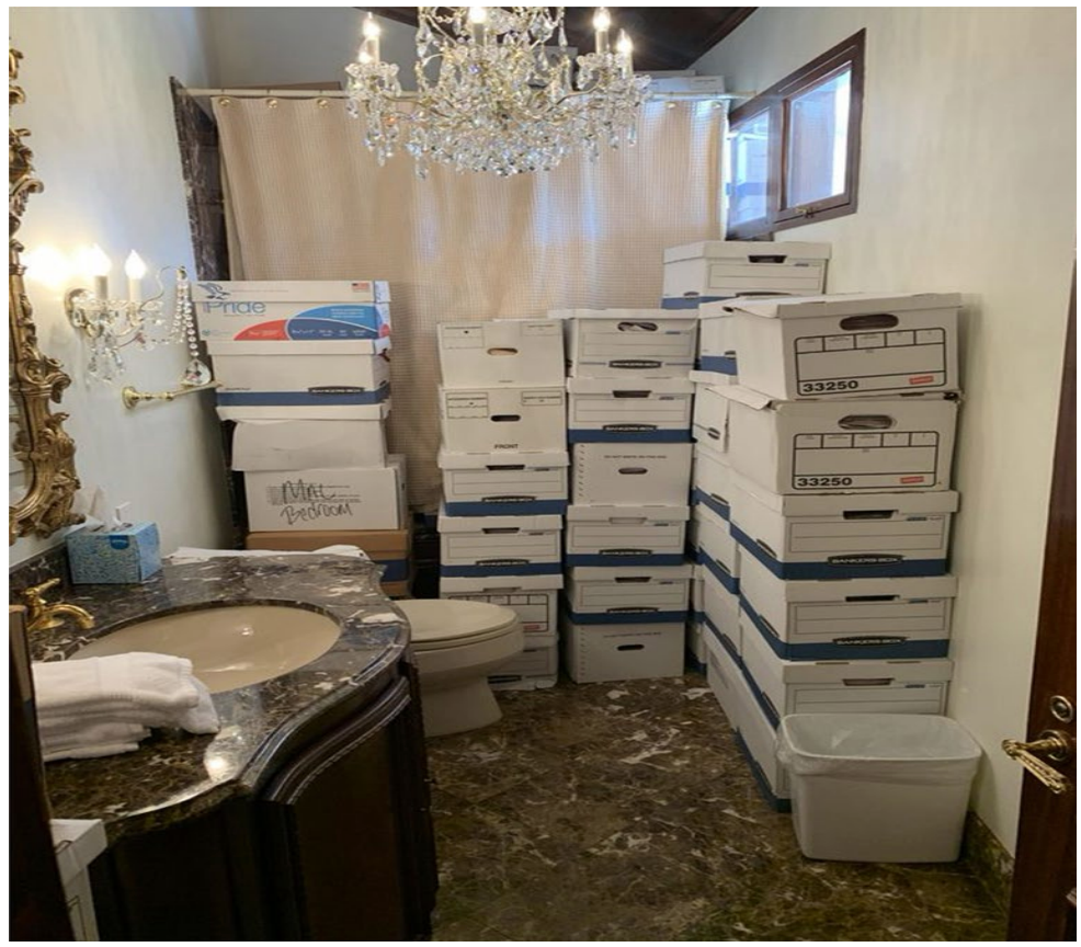 A photo included in a U.S. Department of Justice indictment shows file boxes allegedly containing classified materials stored in a bathroom at Trump's Mar-a-Lago resort. The photo is presented as evidence against Trump and his alleged mishandling and withholding of classified materials after he left the White House in 2021.