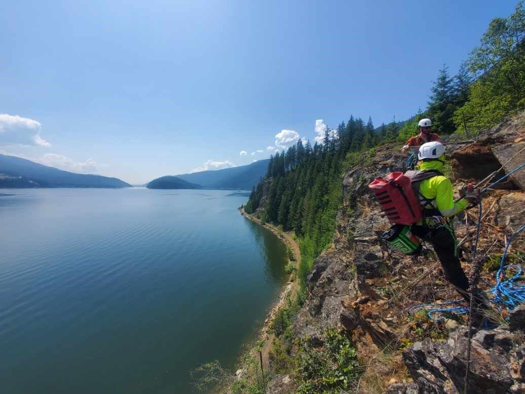 Workers doing rock scaling along the Shuswap North Okanagan Rail Trail near Sicamous.