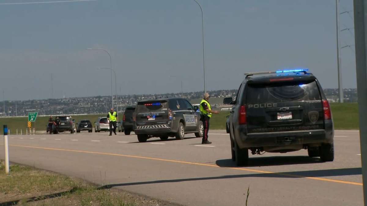 Tsuut'ina police detour motorists around the scene of a Thursday morning motorcycle crash on Tsuut'ina Trail.