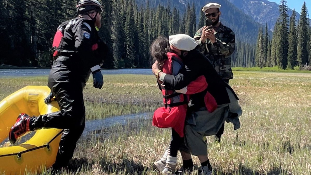 Shunghla Mashwani hugging a family member.