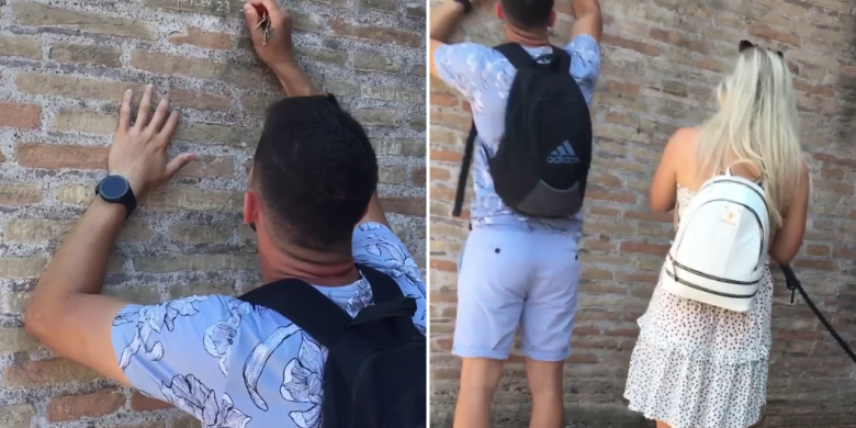 Hunt on for tourist caught on video carving names onto Colosseum wall