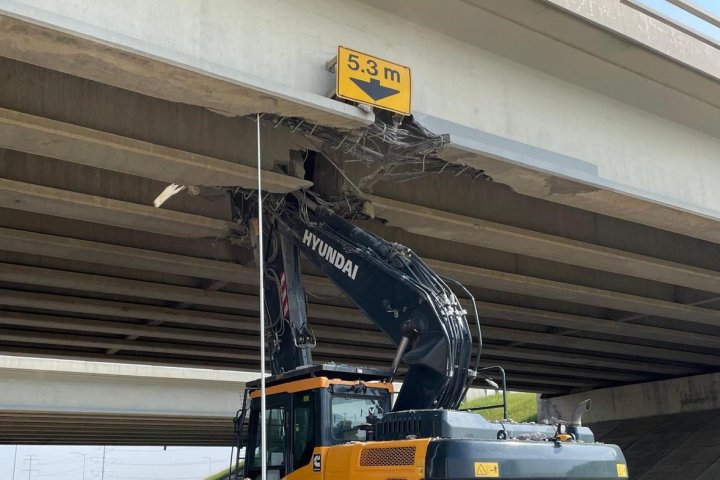 Driver charged after excavator stuck under Whitemud overpass on Anthony Henday