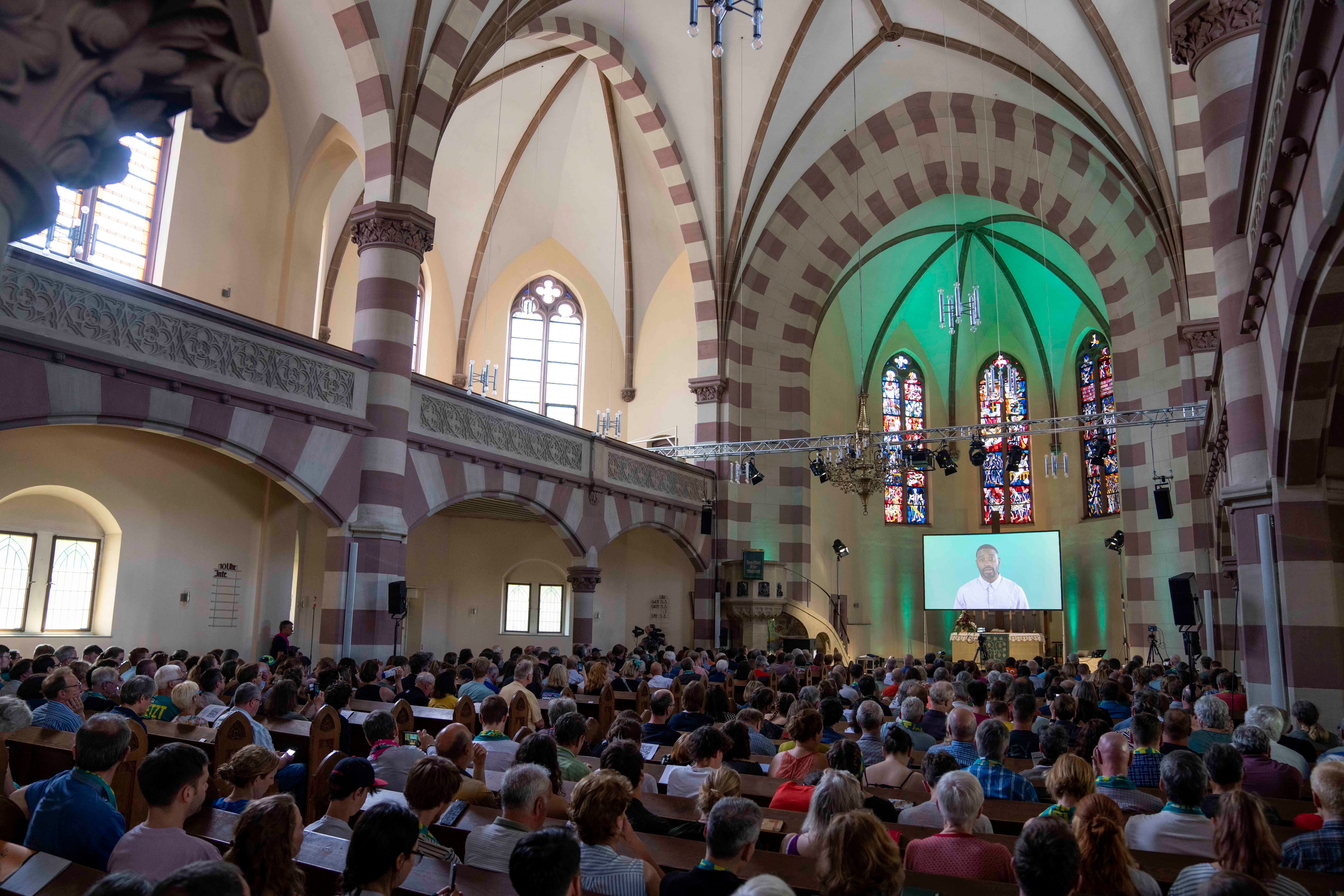 Congregation of over 300 people attending an AI generated church service at St Pauls Church in Nuremberg Germany where ChatGPT avatars led prayers and sermons
