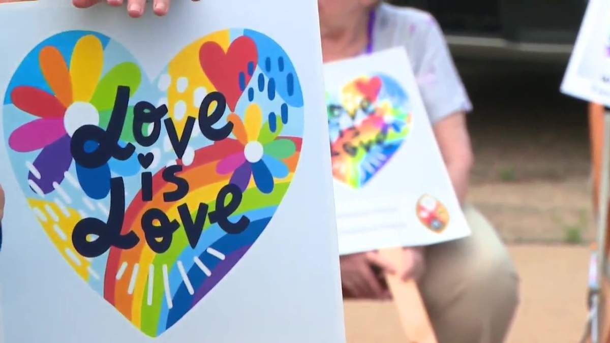 A poster that says Love is Love from a pride event in Westlock on Tuesday.