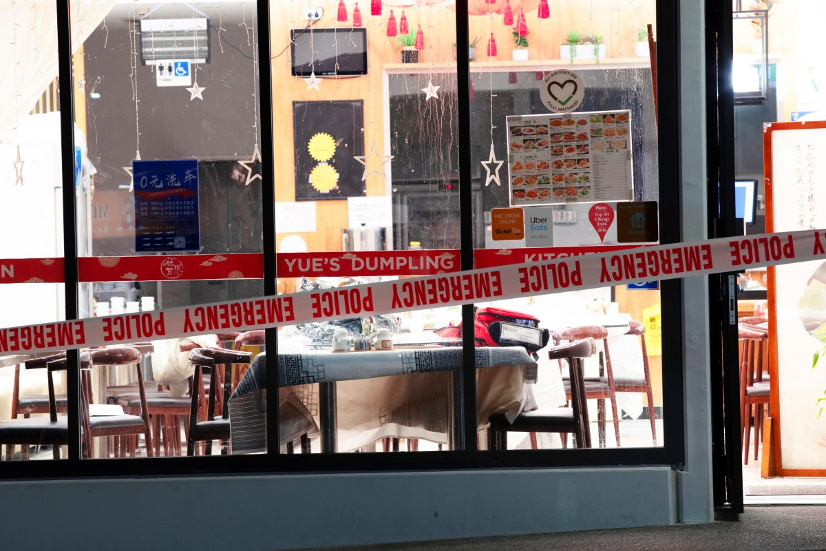 Police tape cordons off a restaurant in Auckland, New Zealand, Tuesday, June 20, 2023, after an axe attack late Monday. Multiple people were hospitalized after a man armed with an axe began attacking diners at random at three neighboring Chinese restaurants, according to police and witnesses. 
