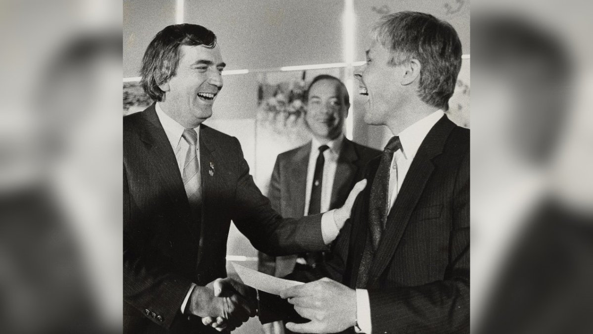 Federal Sports Minister Jacques Olivier, left, presents a cheque to chairman of the Calgary Olympic Development Association Bob Niven at a ceremony in Calgary on March 30, 1984. Niven, who was president of the bid committee for the 1988 Calgary Winter Games, died May 26 at the age of 80. Niven was vice-chair of the organizing committee and served as mayor of the Olympic village during the Games. THE CANADIAN PRESS/Pat Price).