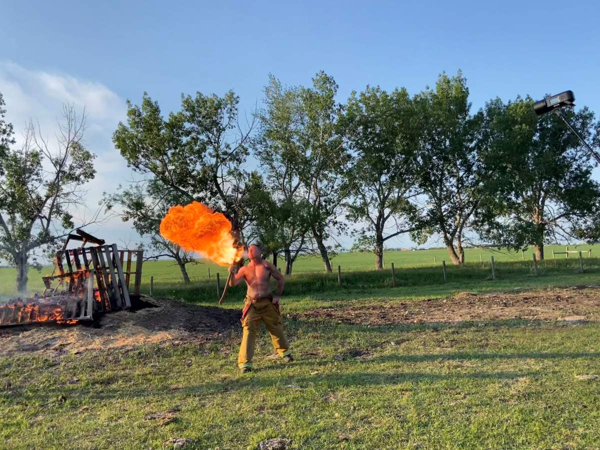 Firefighter ‘blows fire’ for photo shoot.