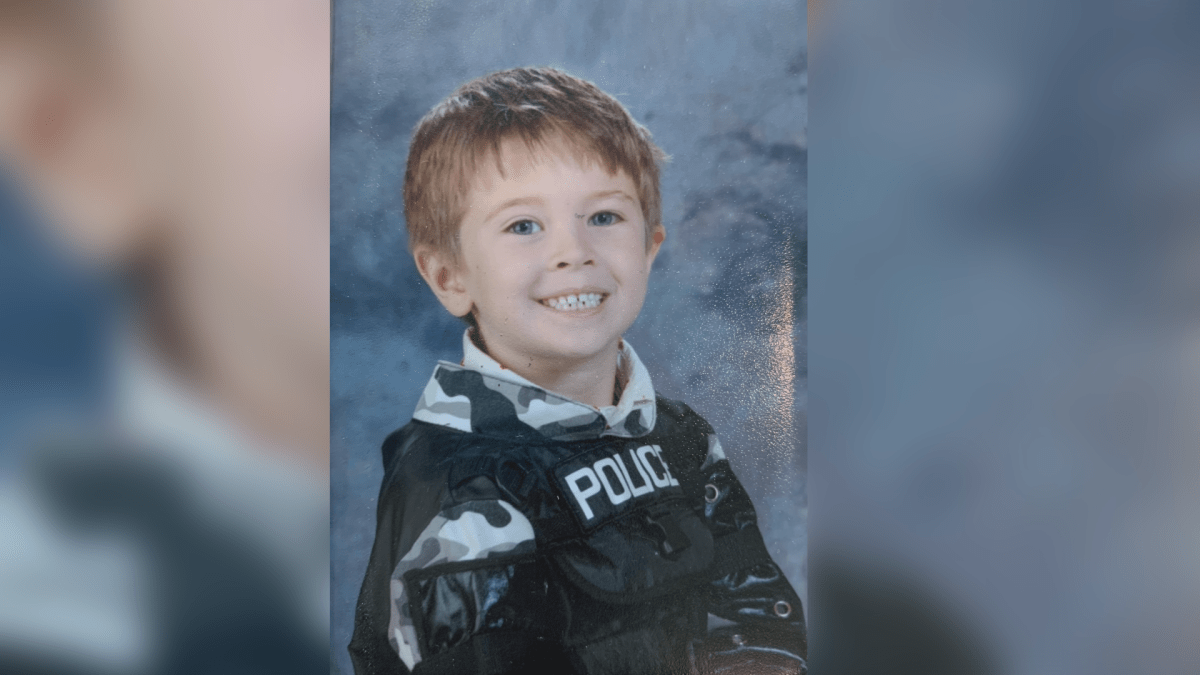 Sawyer Toews the winner of the contest in a police uniform for a school picture