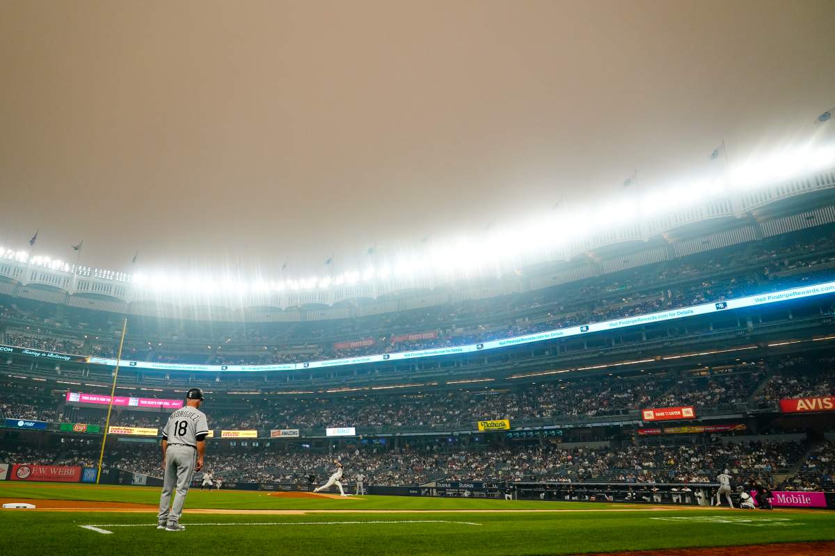 New York Yankees’ Clarke Schmidt pitches to Chicago White Sox’s Tim Anderson during the first inning of a baseball game Tuesday in New York. Smoke from Canadian wildfires has travelled into the United States, resulting in a number of air quality alerts issued since May. (AP Photo/Frank Franklin II)