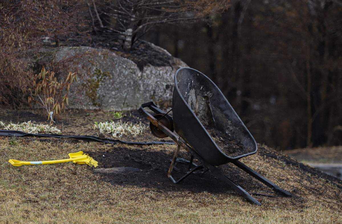 A burnt wheelbarrow and melted shovel are seen near a destroyed home on Carmel Crescent following last week’s wildfire in Hammonds Plains, N.S. Tuesday June 6, 2023.