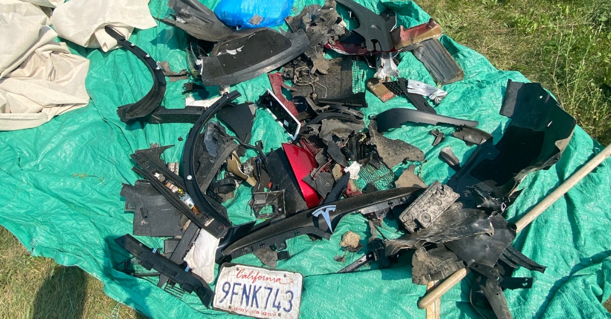 Pieces of the decimated car were fished out of a nearby yard, Monday, June 12, 2023.