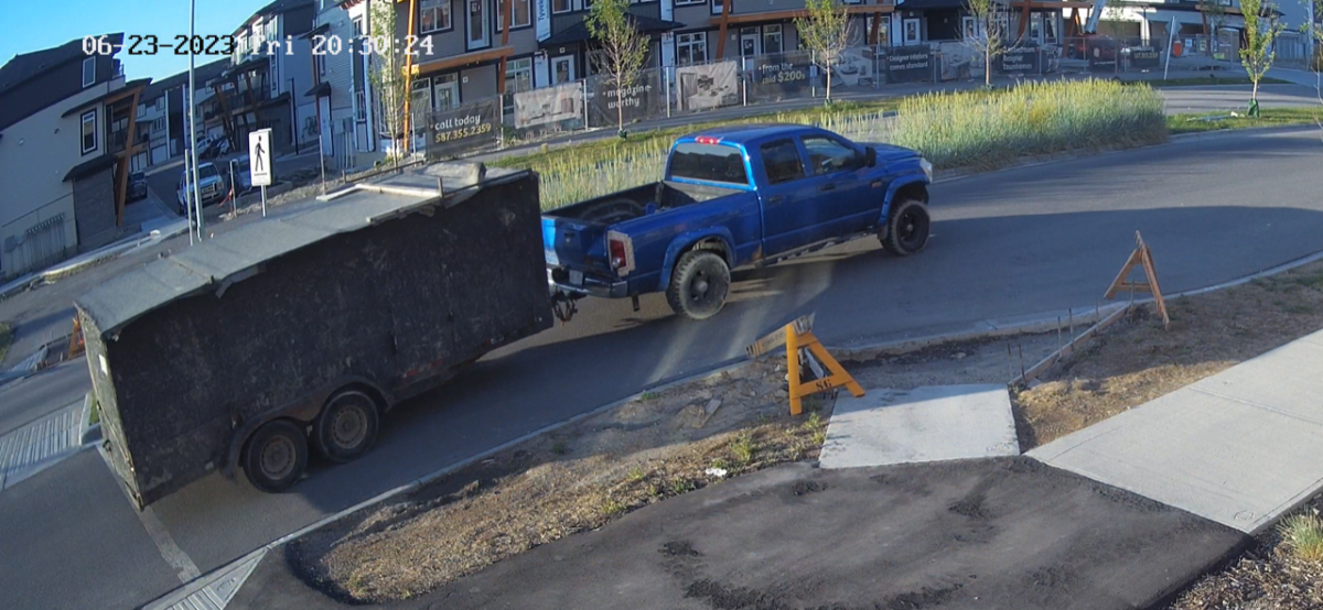 A CCTV image of a blue pickup truck Calgary police believe was involved in a hit-and-run on June 23, 2023.