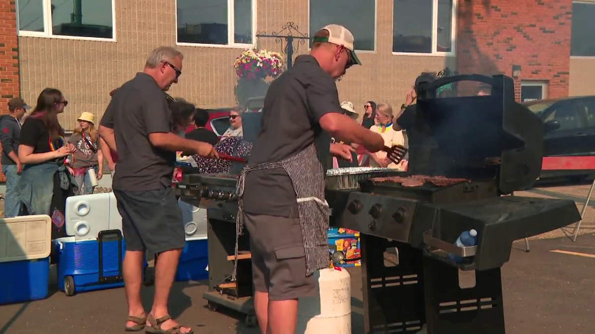 People barbequing at Westlock's Pride event on June 27, 2023.