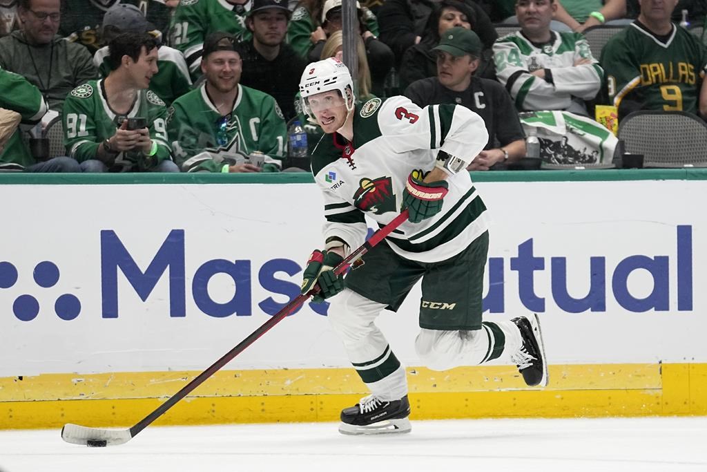 Minnesota Wild defenceman John Klingberg handles the puck during Game 5 of an NHL hockey Stanley Cup first-round playoff series against the Dallas Stars, in Dallas, Tuesday, April 25, 2023.