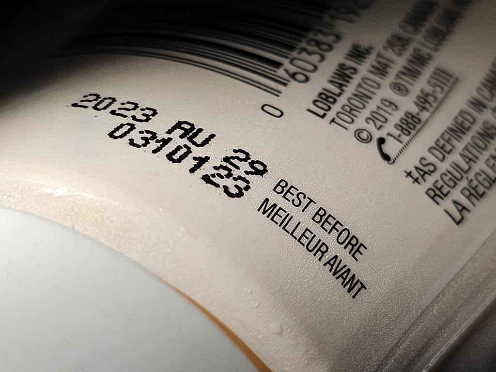 A "best before" date is shown on a food container in Toronto, Tuesday, July 4, 2023. A report from a House committee is recommending the government take another look at its rules around best before dates in an effort to cut down on food waste. THE CANADIAN PRESS/Giordano Ciampini.