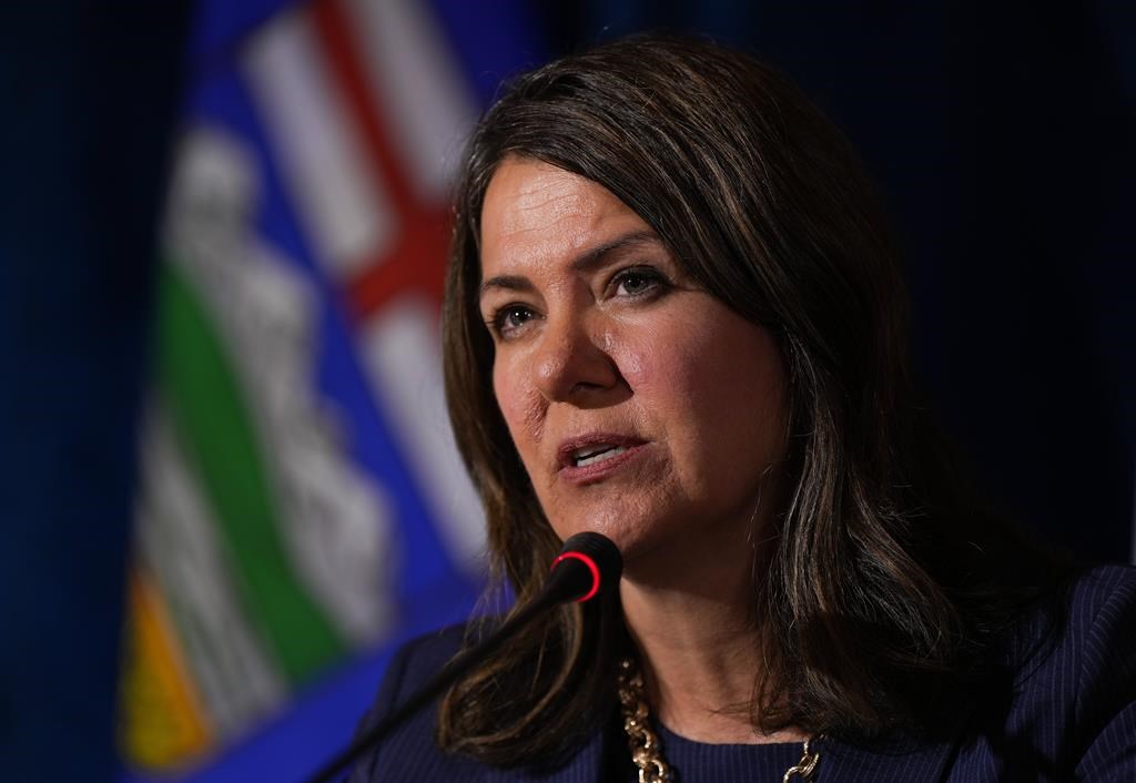 Alberta Premier Danielle Smith responds to a question during a news conference after a meeting of western premiers, in Whistler, B.C., on Tuesday, June 27, 2023.